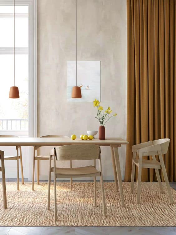 北歐極簡風通常使用白、灰、淺木色配色，並選用簡約的家具設計